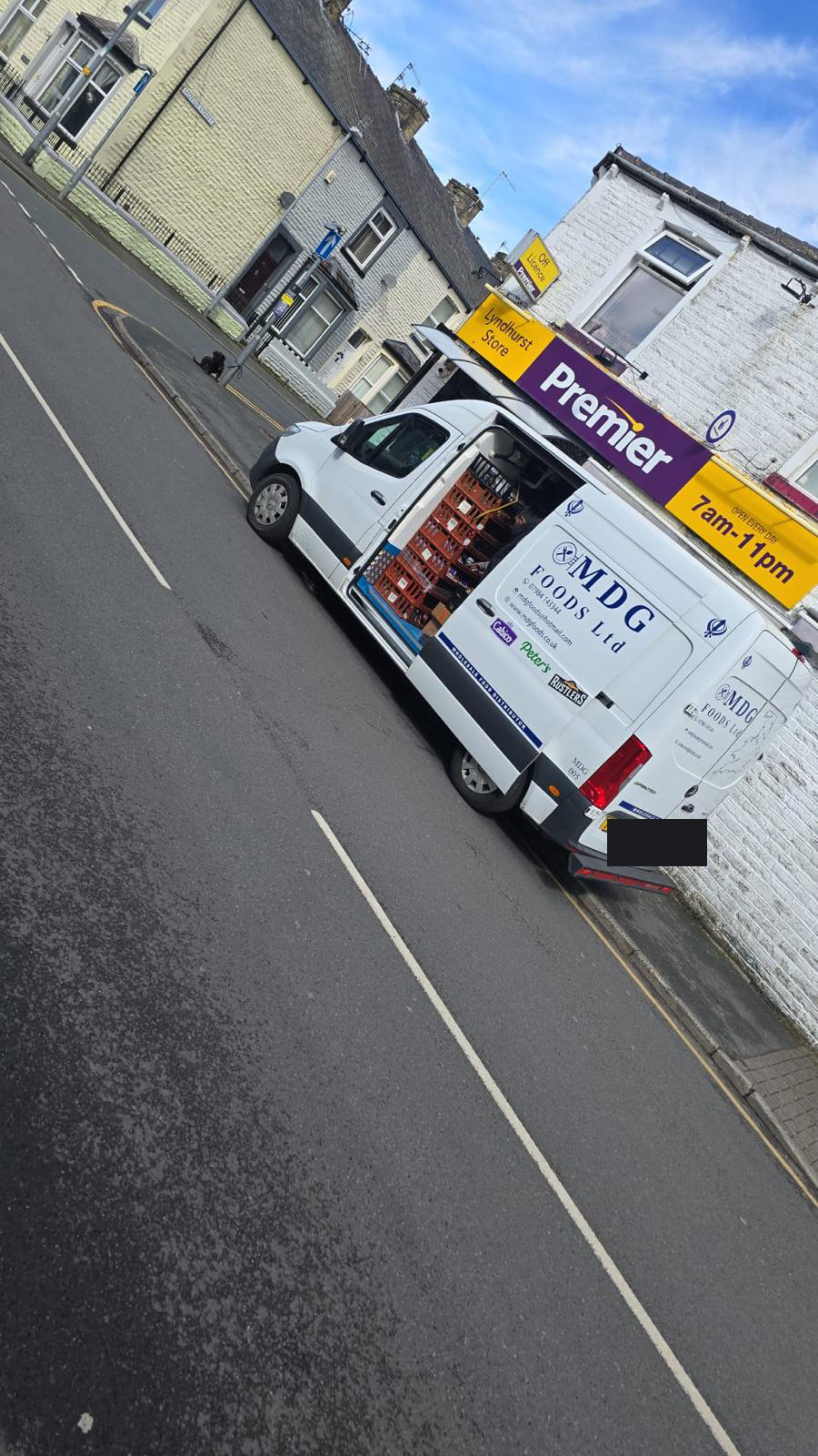 MDG Foods van delivering to an independent convenience store